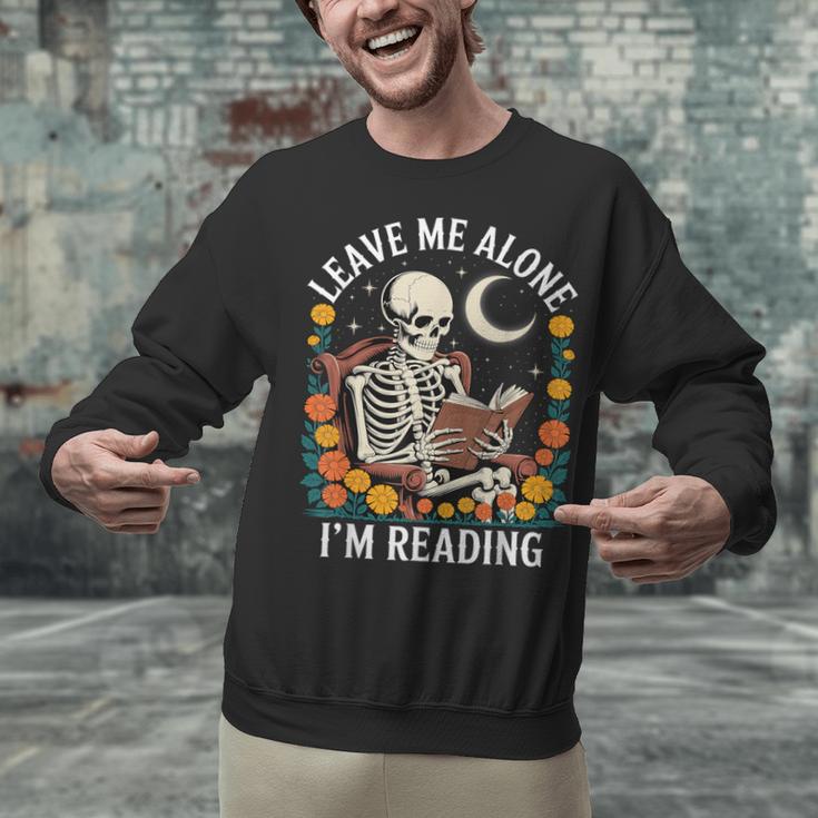 Leave Me Alone Skeleton Reading Book Floral Moon Librarian Unisex Sweatshirt