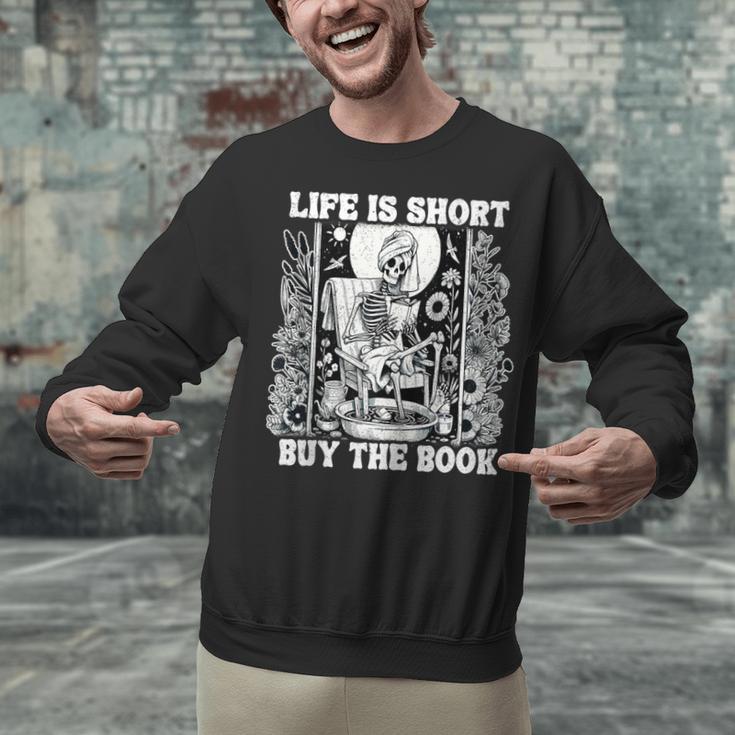 Life Is Short Buy The Book Introvert Skeleton Reading Unisex Sweatshirt Life Is Short Buy The Book Introvert Skeleton Reading Unisex Sweatshirt