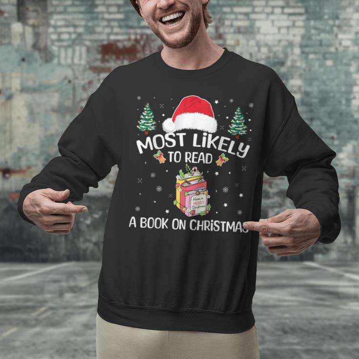 Most Likely To Read A Book On Christmas Love Reading Books Unisex Sweatshirt