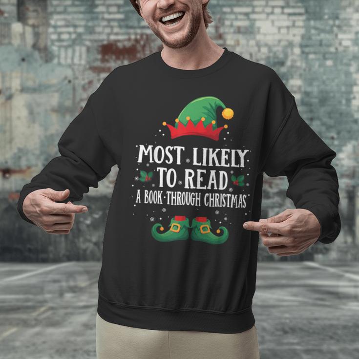 Most Likely To Read A Book Matching Christmas Elf Unisex Sweatshirt Most Likely To Read A Book Matching Christmas Elf Unisex Sweatshirt