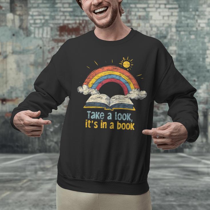 Take a Look It's In a Book Vintage Reading Teacher Rainbow Unisex Sweatshirt Take a Look It's In a Book Vintage Reading Teacher Rainbow Unisex Sweatshirt