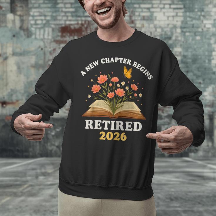 A New Chapter Begins Retired 2026 Floral Book Butterfly Tee Unisex Sweatshirt