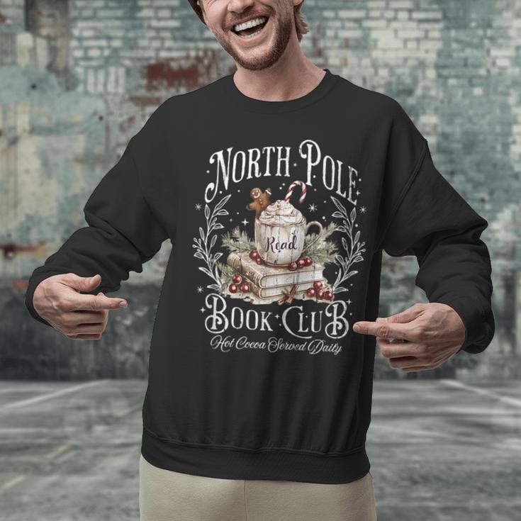 North Pole Book Club Hot Cocoa Served Daily Unisex Sweatshirt