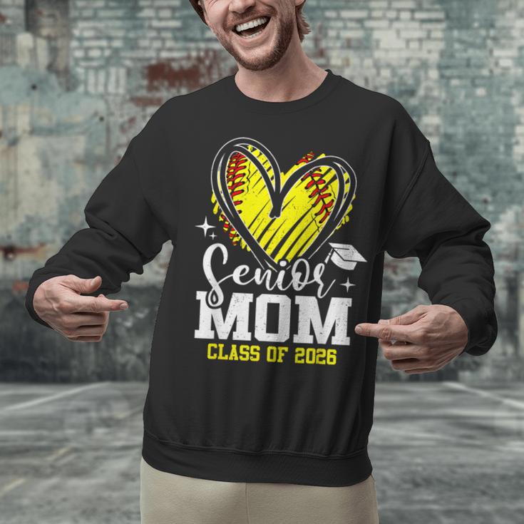 Proud Senior Mom Class Of 2026 Softball Graduation Heart Unisex Sweatshirt