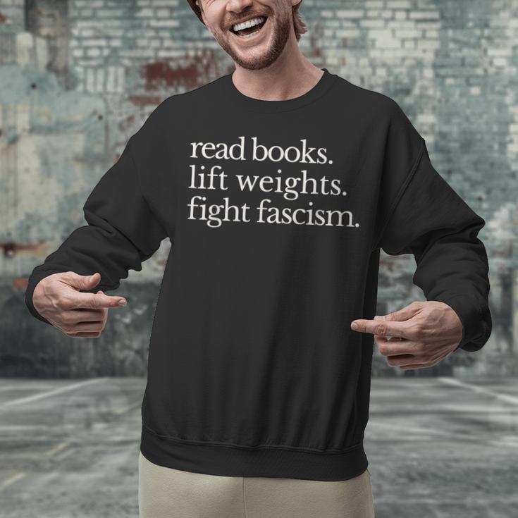 Read Books Lift Weights Fight Fascism Unisex Sweatshirt Read Books Lift Weights Fight Fascism Unisex Sweatshirt