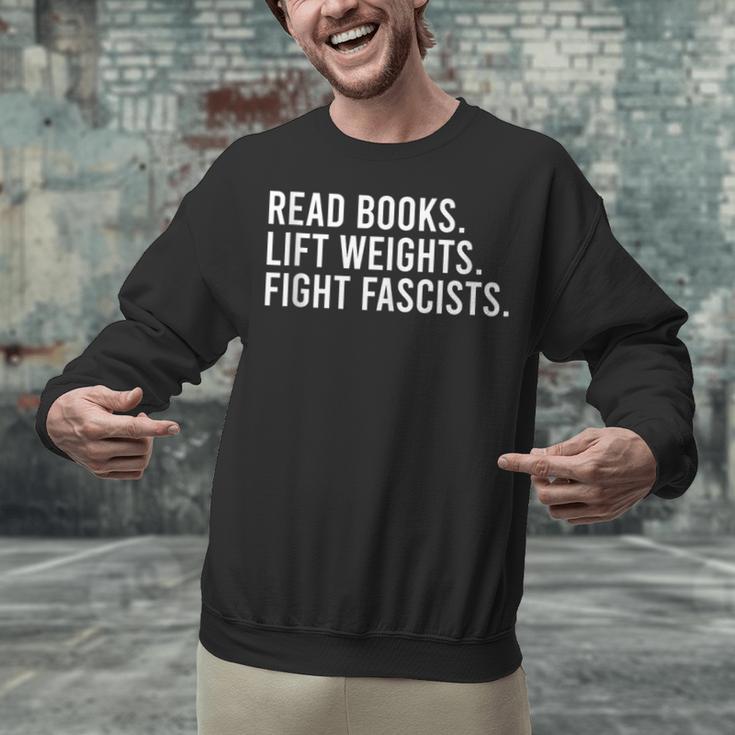 Read Books Lift Weights Fight Fascists Reading Activism Unisex Sweatshirt Read Books Lift Weights Fight Fascists Reading Activism Unisex Sweatshirt