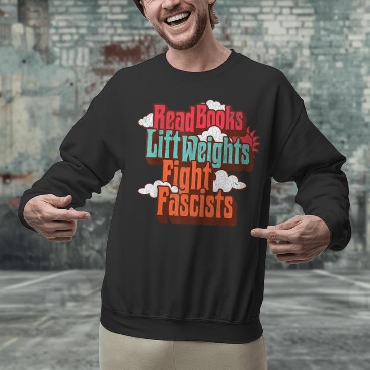 Read Books Lift Weights Fight Fascists Reading No Kings Unisex Sweatshirt Read Books Lift Weights Fight Fascists Reading No Kings Unisex Sweatshirt