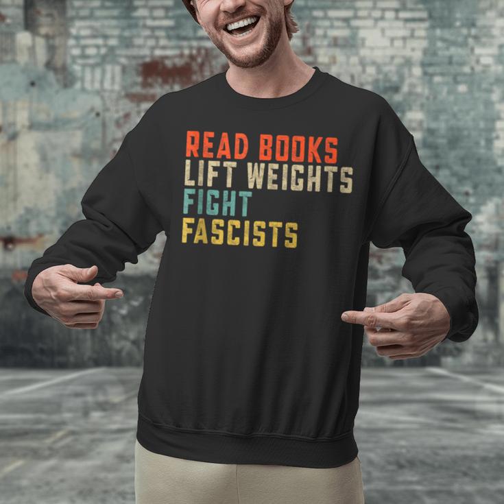 Read Books Lift Weights Fight Fascists Reading Unisex Sweatshirt Read Books Lift Weights Fight Fascists Reading Unisex Sweatshirt