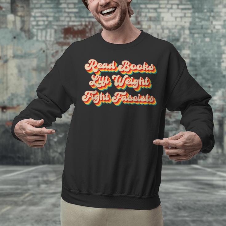 Read Books Lift Weights Fight Fascists Retro Reading Unisex Sweatshirt Read Books Lift Weights Fight Fascists Retro Reading Unisex Sweatshirt