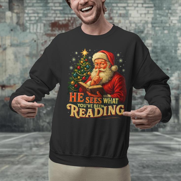 He Sees What You’Ve Been Reading Santa Book Lover Christmas Unisex Sweatshirt He Sees What You’Ve Been Reading Santa Book Lover Christmas Unisex Sweatshirt