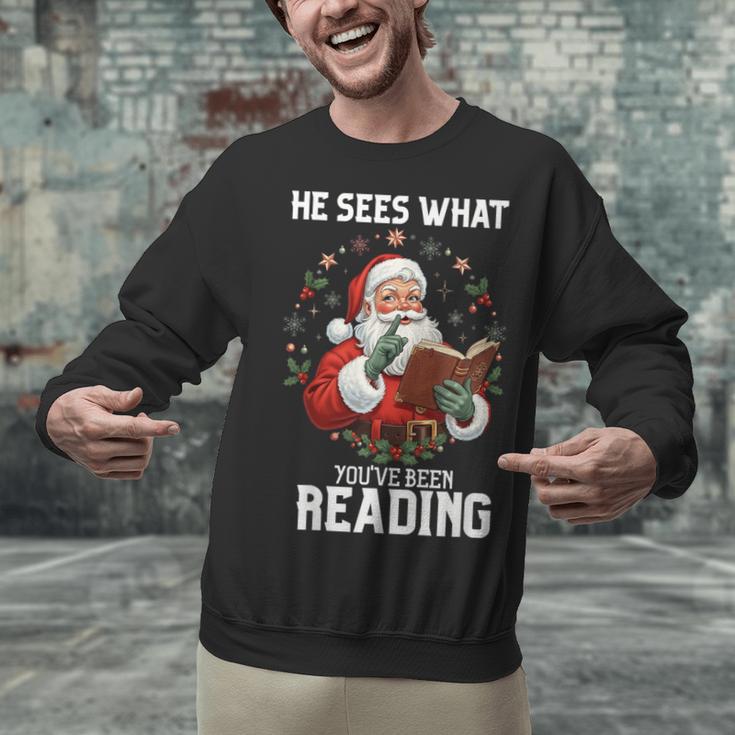 He Sees What You'Ve Been Reading Santa Book Lover Unisex Sweatshirt