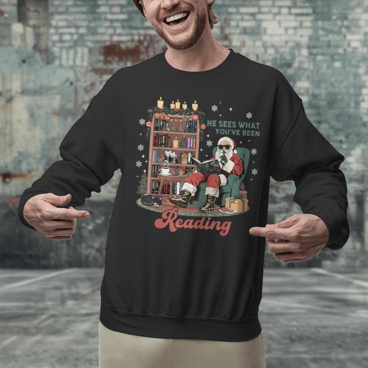 He Sees What You'Ve Been Reading Santa Christmas Bookish Unisex Sweatshirt He Sees What You'Ve Been Reading Santa Christmas Bookish Unisex Sweatshirt
