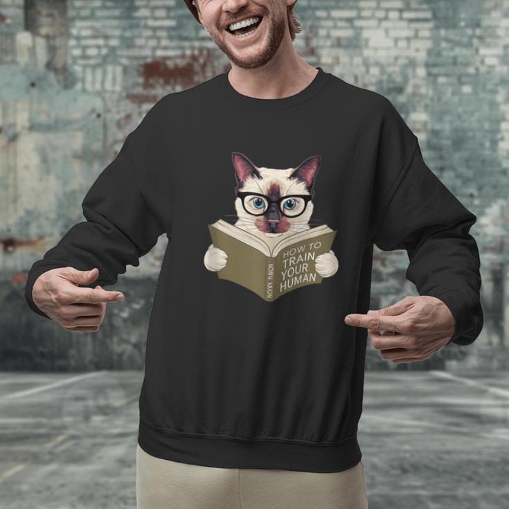 Siamese Cat Reading Book How To Train Your Human Humorous Unisex Sweatshirt Siamese Cat Reading Book How To Train Your Human Humorous Unisex Sweatshirt
