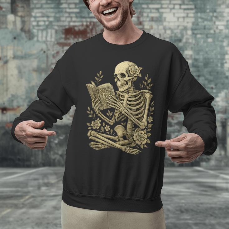 Skeleton Book Floral Skull Halloween Teacher Costume Unisex Sweatshirt Skeleton Book Floral Skull Halloween Teacher Costume Unisex Sweatshirt