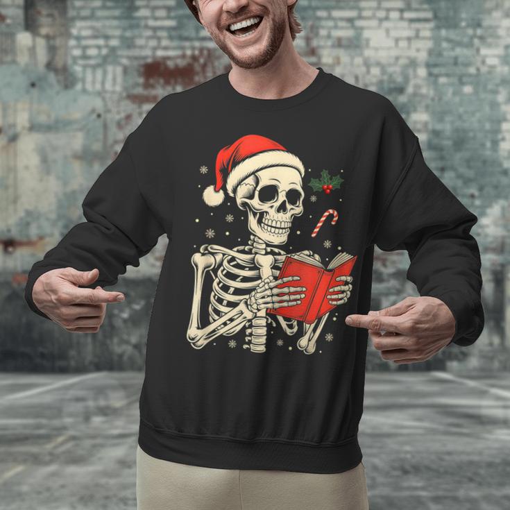 Skeleton Reading Book Christmas Teacher Librarian Book Lover Unisex Sweatshirt