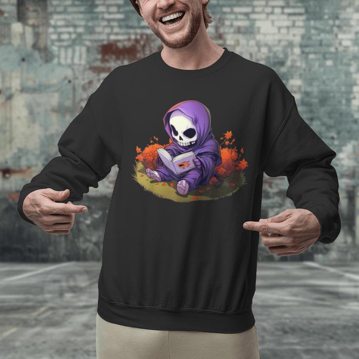 Spooky Grim Reaper Reading A Book Cute Creepy Halloween Unisex Sweatshirt Spooky Grim Reaper Reading A Book Cute Creepy Halloween Unisex Sweatshirt