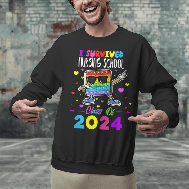 I Survived Nursing School Of 2024 Student Graduation 2024 Unisex Sweatshirt