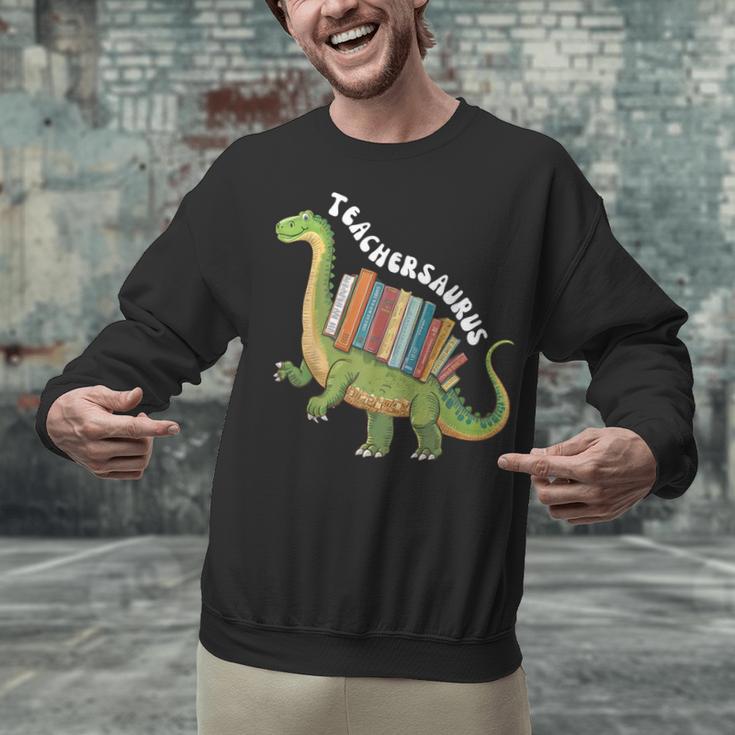Teachersaurus Dinosaur Teachers Dino Reading Book Librarian Unisex Sweatshirt Teachersaurus Dinosaur Teachers Dino Reading Book Librarian Unisex Sweatshirt