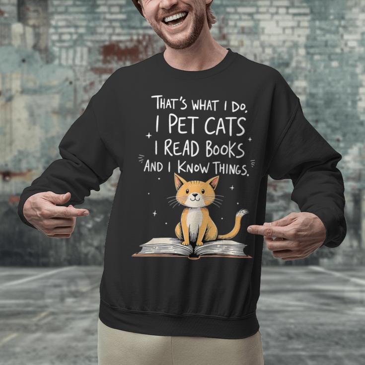 That's What I Do I Pet Cats I Read Books And I Know Things Unisex Sweatshirt