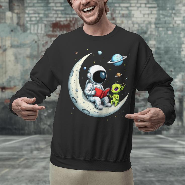 UFO Alien Astronaut Reading Book In Space Unisex Sweatshirt