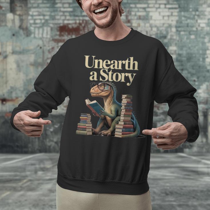 Unearth A Story Dinosaur Reading a Library Book Unisex Sweatshirt