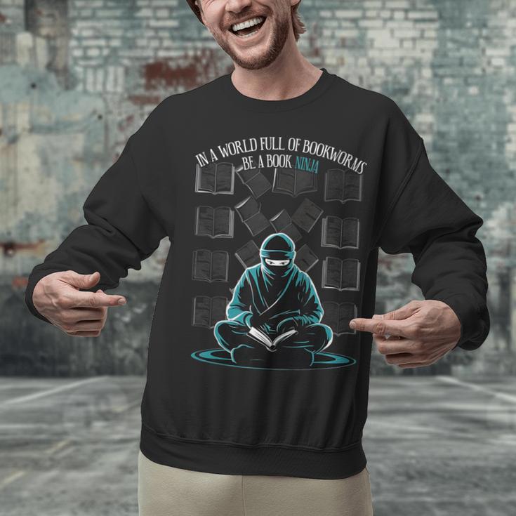 In A World Full Of Bookworms Be A Book Ninja Reading Reader Unisex Sweatshirt