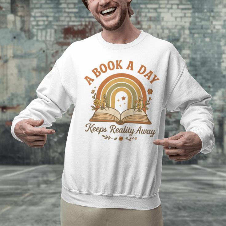 A Book A Day Keeps Reality Away Reading Unisex Sweatshirt A Book A Day Keeps Reality Away Reading Unisex Sweatshirt