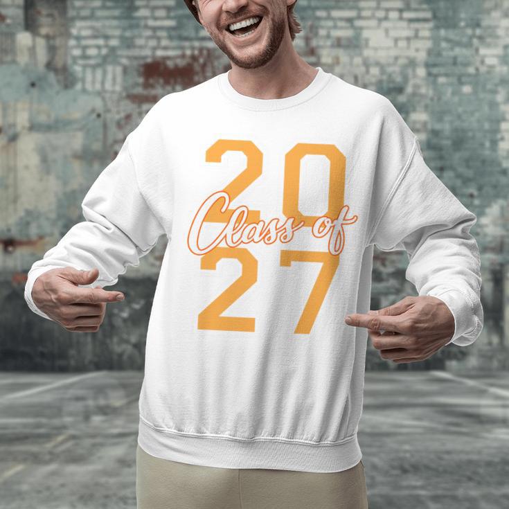 Class Of 2027 Graduation Varsity Orange On The Back Premium Tri-Blend Unisex Sweatshirt