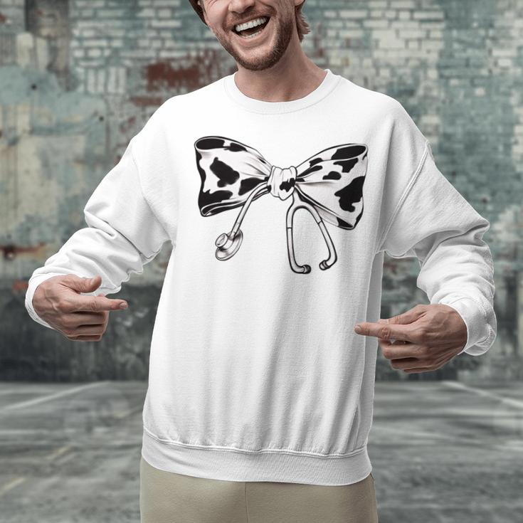 Cow Print Bow And Stethoscope Nurse RN Graduation Coquette Unisex Sweatshirt