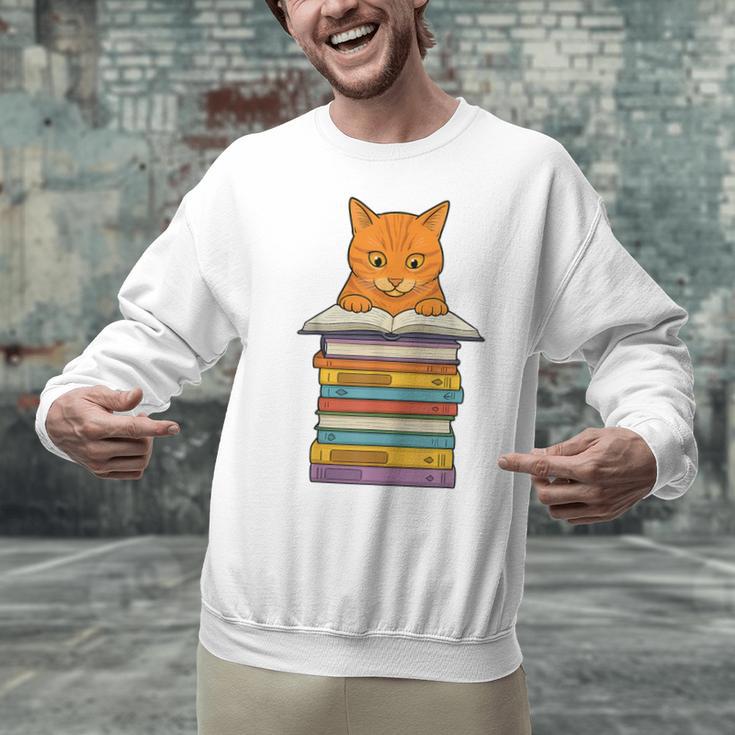 Cute Orange Tabby Cat Reading On Pile Of Books Unisex Sweatshirt Cute Orange Tabby Cat Reading On Pile Of Books Unisex Sweatshirt