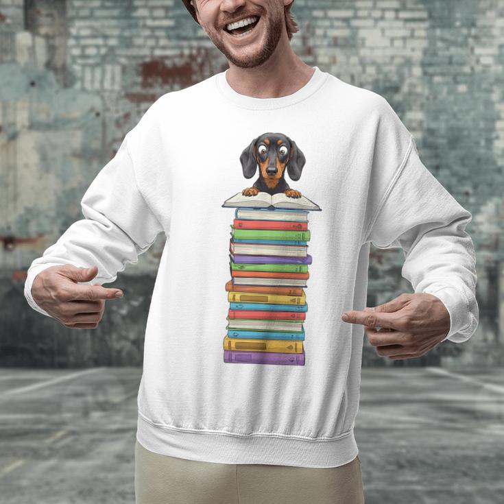Cute Wiener Dog Dachshund Reading On Pile Of Books Unisex Sweatshirt Cute Wiener Dog Dachshund Reading On Pile Of Books Unisex Sweatshirt