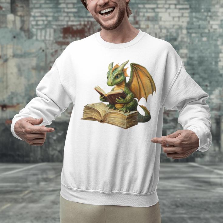 Dragon Bookworm Reading Book Graphic Unisex Sweatshirt Dragon Bookworm Reading Book Graphic Unisex Sweatshirt