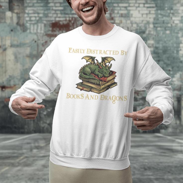 Easily Distracted By Books And Dragons Graphic Premium Unisex Sweatshirt