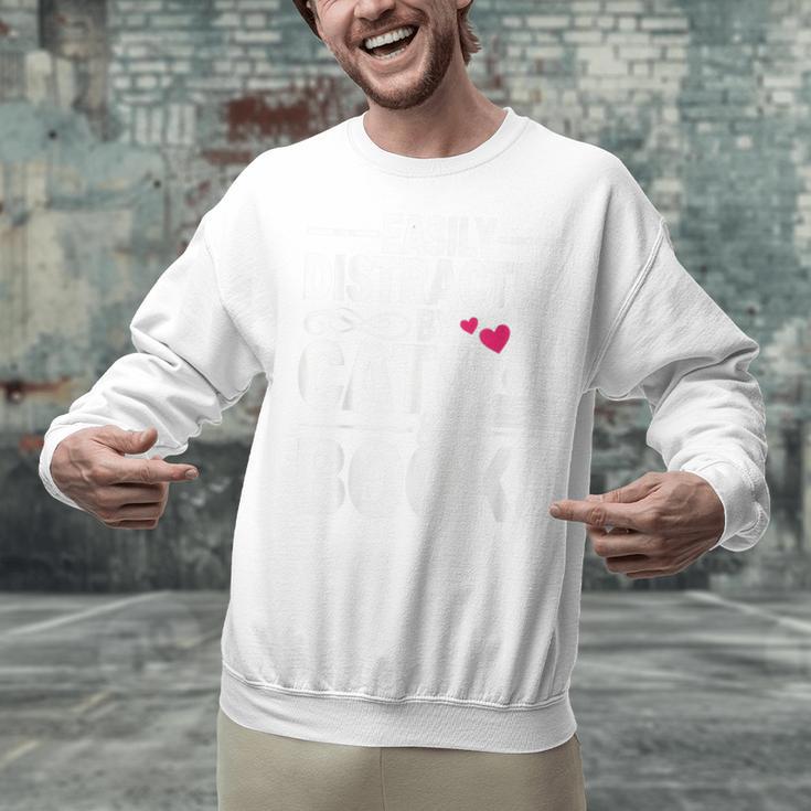 Easily Distracted By Cats And Books Cat & Book Lover Unisex Sweatshirt