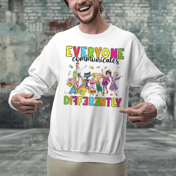 Everyone Communicates Differently Book Teacher Outfit Unisex Sweatshirt