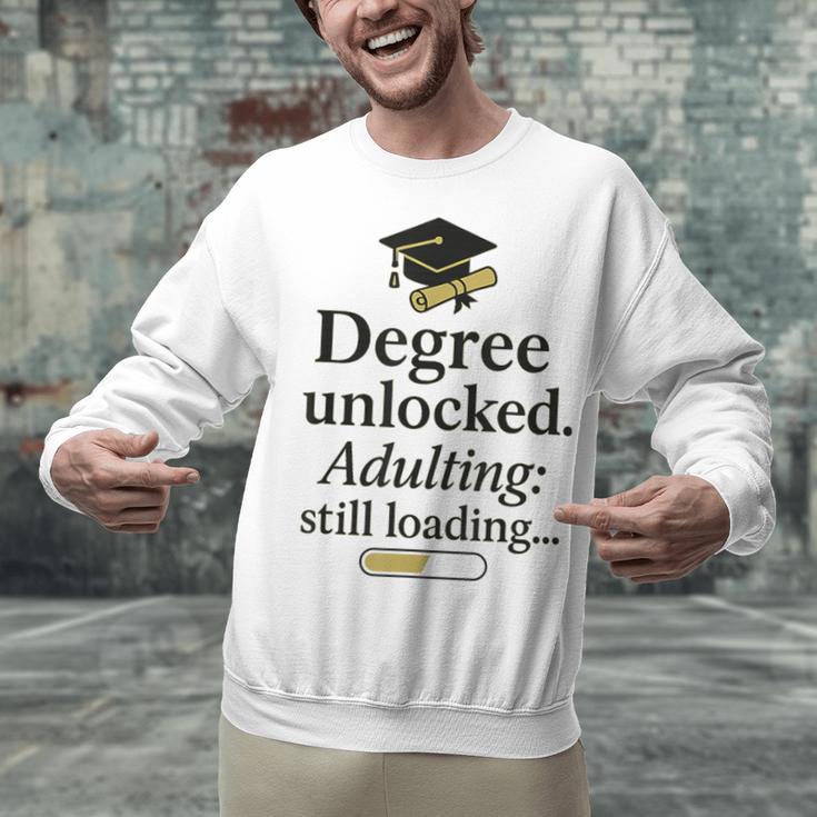 Graduation 2025 Degree Unlocked Adulting Still Loading Unisex Sweatshirt