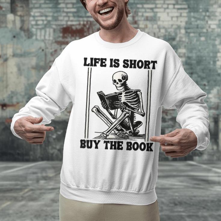 Life Is Short Buy The Book Skeleton Book Lover Reading Unisex Sweatshirt Life Is Short Buy The Book Skeleton Book Lover Reading Unisex Sweatshirt