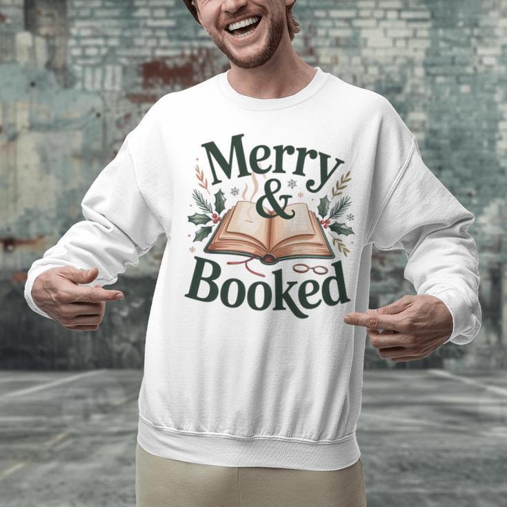 Merry And Booked Holiday Reading Winter Book Lover Premium Tri-Blend Unisex Sweatshirt