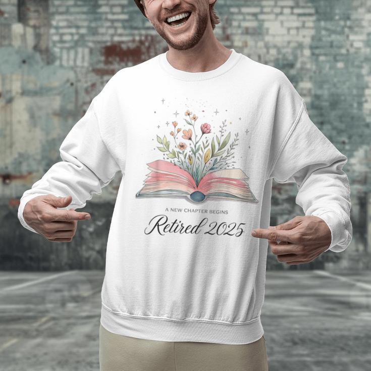 Quote New Chapter Begins Retired 2025 Floral Open Book Unisex Sweatshirt Quote New Chapter Begins Retired 2025 Floral Open Book Unisex Sweatshirt