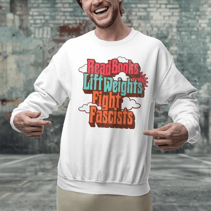 Read Books Lift Weights Fight Fascists Reading No Kings Premium Tri-Blend Unisex Sweatshirt Read Books Lift Weights Fight Fascists Reading No Kings Premium Tri-Blend Unisex Sweatshirt