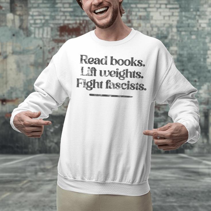 Read Books Lift Weights Fight Fascists Vintage Unisex Sweatshirt