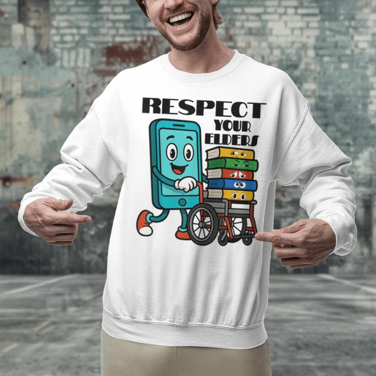 Respect Elders Cellphone Pushing Books In a Wheelchair Unisex Sweatshirt Respect Elders Cellphone Pushing Books In a Wheelchair Unisex Sweatshirt