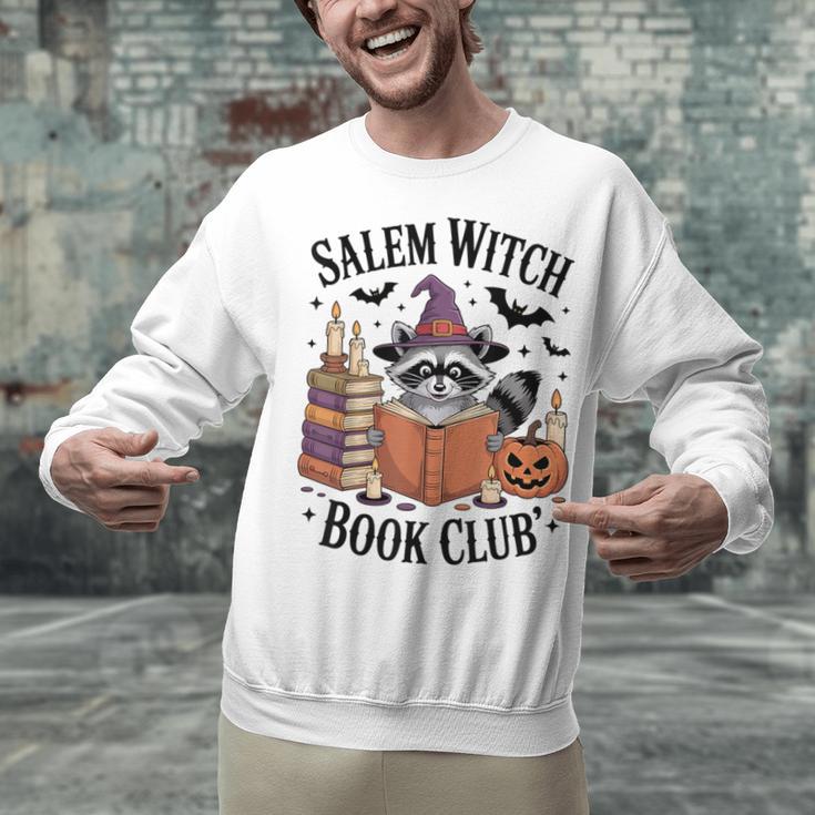 Salem WItch Book Club Halloween Raccoon Witch Reading Book Unisex Sweatshirt Salem WItch Book Club Halloween Raccoon Witch Reading Book Unisex Sweatshirt