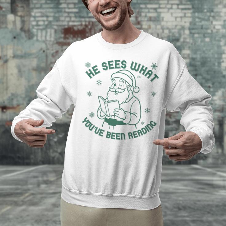He Sees What You'Ve Been Reading Christmas Bookish Santa Premium Tri-Blend Unisex Sweatshirt He Sees What You'Ve Been Reading Christmas Bookish Santa Premium Tri-Blend Unisex Sweatshirt