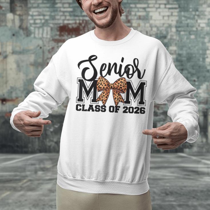 Senior Mom Class Of 2026 Graduation Leopard Coquette Bow Unisex Sweatshirt