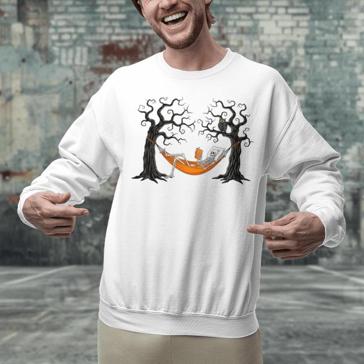 Skeleton Reading Book In Hammock Halloween Reader Unisex Sweatshirt
