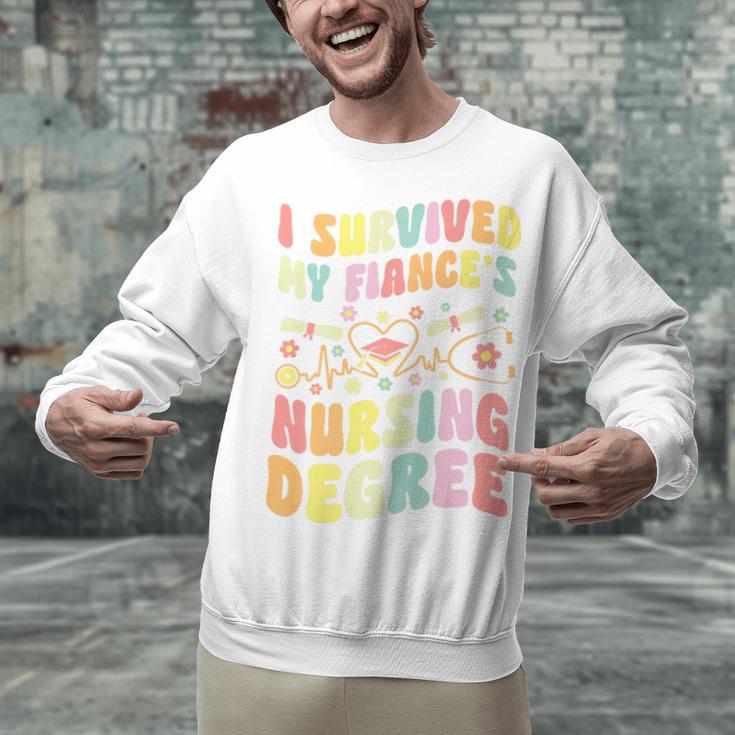 i Survived My Fiance's Nursing Degree Graduation Groovy Premium Unisex Sweatshirt