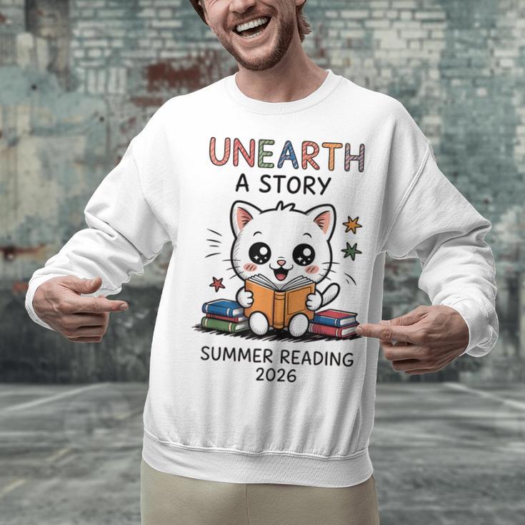 Unearth a Story Cute Kitten Summer Reading 2026 Cat Book Unisex Sweatshirt
