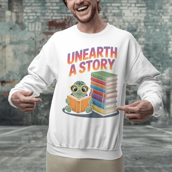 Unearth A Story Cute Turtle Reading Books Librarian Unisex Sweatshirt