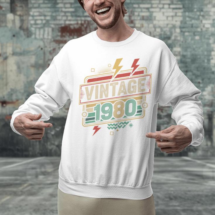 Vintage 1980 Retro Badge Decade Nostalgia Graphic Emblem Premium Tri-Blend Unisex Sweatshirt